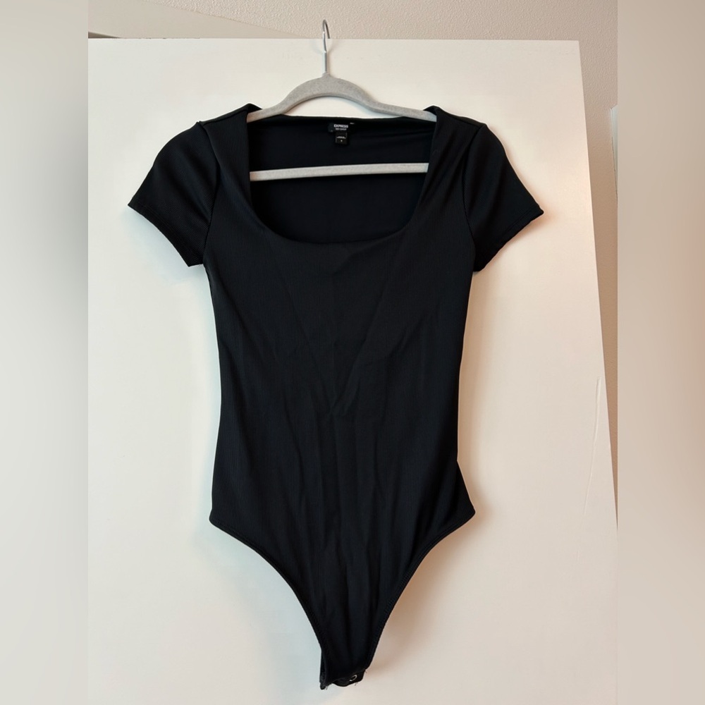 Express woman’s black body suit